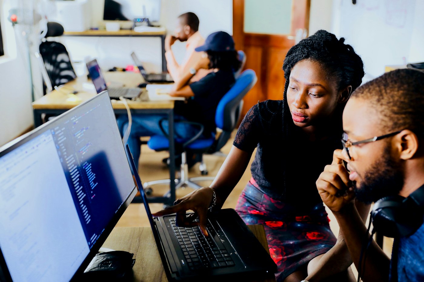 Students collaborating on code during a live learning session